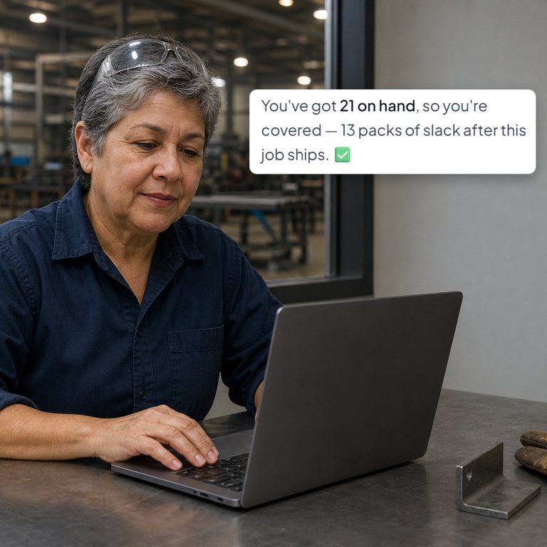 A woman in a fabrication shop office at a laptop, beside a real IQ Assistant answer saying 21 are on hand, enough to cover the job with 13 packs of slack, with demo data (AI-generated scene).